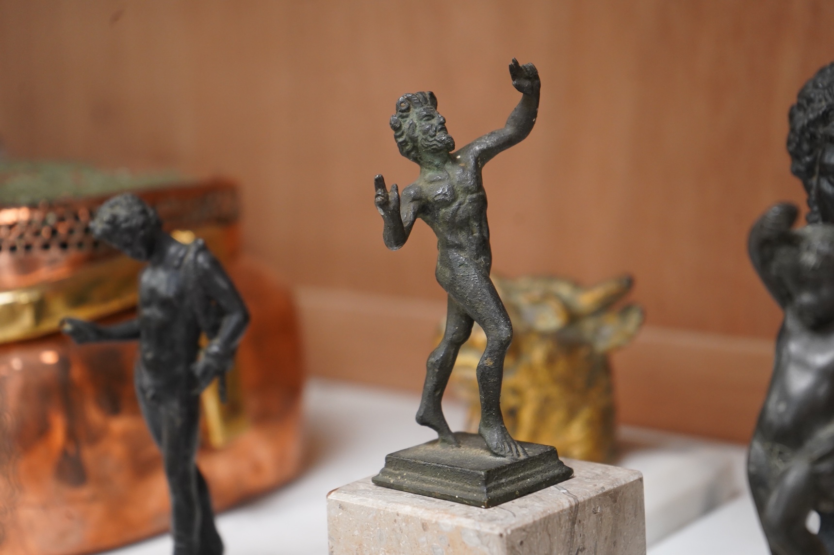 Italian grand tour souvenirs, 19th/20th century; nine small sculptures and busts, after the antique, the majority bronze and one depicting Lucius Verus, largest 19cm high